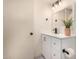Clean bathroom featuring a white vanity, toilet paper holder, and a large mirror at 461 W Holmes Ave # 323, Mesa, AZ 85210