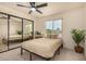 Cozy bedroom with a mirrored closet and a ceiling fan, creating a relaxing atmosphere at 461 W Holmes Ave # 323, Mesa, AZ 85210