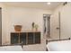 Bedroom with twin beds and dresser with a cactus in a pot at 461 W Holmes Ave # 323, Mesa, AZ 85210