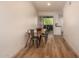 Dining table featuring industrial metal chairs and a view through to the kitchen and screened patio at 461 W Holmes Ave # 323, Mesa, AZ 85210