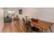 Modern dining area featuring industrial metal chairs and a hardwood dining table with a basket centerpiece at 461 W Holmes Ave # 323, Mesa, AZ 85210