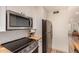 Well-equipped kitchen with stainless steel appliances and ample countertop space at 461 W Holmes Ave # 323, Mesa, AZ 85210