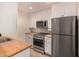 Well-lit kitchen with stainless steel appliances and butcher block countertops at 461 W Holmes Ave # 323, Mesa, AZ 85210