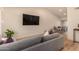 Bright living room featuring neutral colors, hardwood floors, and an open concept dining area at 461 W Holmes Ave # 323, Mesa, AZ 85210