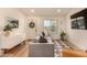 Bright living room featuring hardwood floors and tastefully decorated with plants and modern art at 461 W Holmes Ave # 323, Mesa, AZ 85210