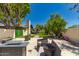 Outdoor space features a modern patio set and artificial turf at 4627 W Laurie Ln, Glendale, AZ 85302