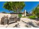 Backyard patio featuring modern outdoor seating, BBQ and artificial turf at 4627 W Laurie Ln, Glendale, AZ 85302