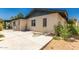 Backyard with stucco exterior, covered patio, and a water faucet at 4627 W Laurie Ln, Glendale, AZ 85302
