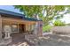 Covered front porch with brick accents, decorative lion statues, and a cozy, welcoming entrance at 4627 W Laurie Ln, Glendale, AZ 85302