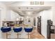 Stylish kitchen features granite counters, stainless appliances, white cabinets, and pendant lighting at 4627 W Laurie Ln, Glendale, AZ 85302
