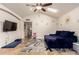 Bright living room featuring vaulted ceilings, skylights, tile flooring, and modern decor at 4627 W Laurie Ln, Glendale, AZ 85302