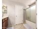 Bathroom featuring white countertops, a shower/tub combination, and neutral tile flooring at 509 S 111Th Dr, Avondale, AZ 85323