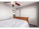 Bedroom with a ceiling fan, closet with doors, and neutral walls at 509 S 111Th Dr, Avondale, AZ 85323