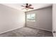 Bedroom featuring a ceiling fan, window, neutral walls, and carpet at 509 S 111Th Dr, Avondale, AZ 85323