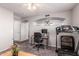 Versatile room featuring a desk, a treadmill, and an open archway at 509 S 111Th Dr, Avondale, AZ 85323