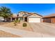Charming two-story home boasts desert landscaping, a two-car garage, and a classic tile roof at 509 S 111Th Dr, Avondale, AZ 85323
