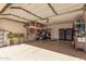 Spacious garage with ample storage, overhead racks, and epoxy flooring at 509 S 111Th Dr, Avondale, AZ 85323