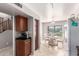 Kitchen and adjacent dining area with staircase access, next to ample cabinet storage at 509 S 111Th Dr, Avondale, AZ 85323