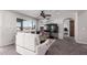Inviting living room with neutral walls, a ceiling fan, and plush gray carpet flooring at 509 S 111Th Dr, Avondale, AZ 85323