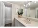 Bright bathroom featuring modern vanity with sink, mirror, and bathtub with curtain at 5104 N 32Nd St # 114, Phoenix, AZ 85018