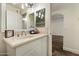 Bathroom featuring vanity with sink, mirror, and lighting fixtures at 5104 N 32Nd St # 114, Phoenix, AZ 85018