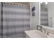 Bathroom with a striped shower curtain and vanity at 5104 N 32Nd St # 114, Phoenix, AZ 85018
