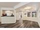Open-concept living space showcasing wood floors and ample natural light at 5104 N 32Nd St # 114, Phoenix, AZ 85018
