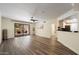 Spacious living room offering hardwood floors, bright lighting, and access to the balcony at 5104 N 32Nd St # 114, Phoenix, AZ 85018