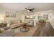 Inviting living room with a ceiling fan, comfortable seating, and views of the dining area at 5104 N 32Nd St # 114, Phoenix, AZ 85018