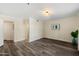 Bright living room featuring neutral walls, wood-look flooring, and open layout at 5104 N 32Nd St # 114, Phoenix, AZ 85018