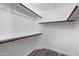 Functional walk-in closet with shelving and rod, maximizing storage space at 5104 N 32Nd St # 114, Phoenix, AZ 85018