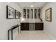 Modern bar area with wine rack and beverage refrigerator at 5250 E Deer Valley Dr # 146, Phoenix, AZ 85054