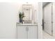 Bathroom with white vanity, granite countertop, and decorative mirror at 5250 E Deer Valley Dr # 146, Phoenix, AZ 85054