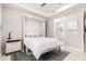 Bedroom featuring a murphy bed, bedside table, and ensuite bathroom at 5250 E Deer Valley Dr # 146, Phoenix, AZ 85054