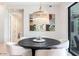 Bright dining area featuring a modern chandelier and contemporary decor at 5250 E Deer Valley Dr # 146, Phoenix, AZ 85054