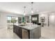 Kitchen view with island and open floorplan to living room at 5250 E Deer Valley Dr # 146, Phoenix, AZ 85054