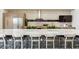 Outdoor kitchen with a large island, barstool seating, stainless steel appliances, and a built-in grill for entertaining at 5250 E Deer Valley Dr # 146, Phoenix, AZ 85054
