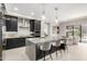 Modern kitchen featuring an island with bar stool seating, stainless steel appliances, and sleek cabinets at 5250 E Deer Valley Dr # 146, Phoenix, AZ 85054