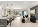Bright, open-concept living room and kitchen with modern furnishings and fireplace feature at 5250 E Deer Valley Dr # 146, Phoenix, AZ 85054