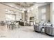 A luxurious lounge area with marble floors, comfortable seating, stylish decor, a large TV, and plenty of natural light at 5250 E Deer Valley Dr # 146, Phoenix, AZ 85054