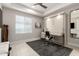 Bedroom office with murphy bed and a desk with white chair at 5250 E Deer Valley Dr # 146, Phoenix, AZ 85054