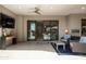 Outdoor patio with large sliding glass doors, ample seating, and a TV making it perfect for relaxing and entertaining at 5250 E Deer Valley Dr # 146, Phoenix, AZ 85054