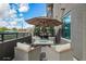 Outdoor patio with comfortable seating, a table with umbrella, and views of the property's surrounding landscape at 5250 E Deer Valley Dr # 146, Phoenix, AZ 85054