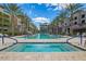 Luxury resort style pool area with tall palm trees, blue skies, community area with many lounge chairs for relaxing and enjoying the sun at 5250 E Deer Valley Dr # 146, Phoenix, AZ 85054