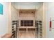 A home's sauna features light wood walls, seating benches, and a glass door with metal handles for luxury and relaxation at 5250 E Deer Valley Dr # 146, Phoenix, AZ 85054
