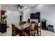 Comfortable dining area with ceramic floors, modern lighting, and neutral wall paint at 5432 W Sunnyside Dr, Glendale, AZ 85304
