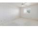 Cozy bedroom with plush carpeting, a ceiling fan and a window offering natural light at 7910 E Navarro Ave, Mesa, AZ 85209