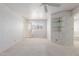 Spacious bedroom features neutral carpet, en-suite bathroom and a large window at 7910 E Navarro Ave, Mesa, AZ 85209