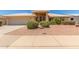 Charming single-story home with a well-maintained yard and a two-car garage at 7910 E Navarro Ave, Mesa, AZ 85209