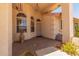 Covered front porch with decorative features and a cozy entrance at 7910 E Navarro Ave, Mesa, AZ 85209